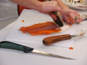 scraping salmon fillet